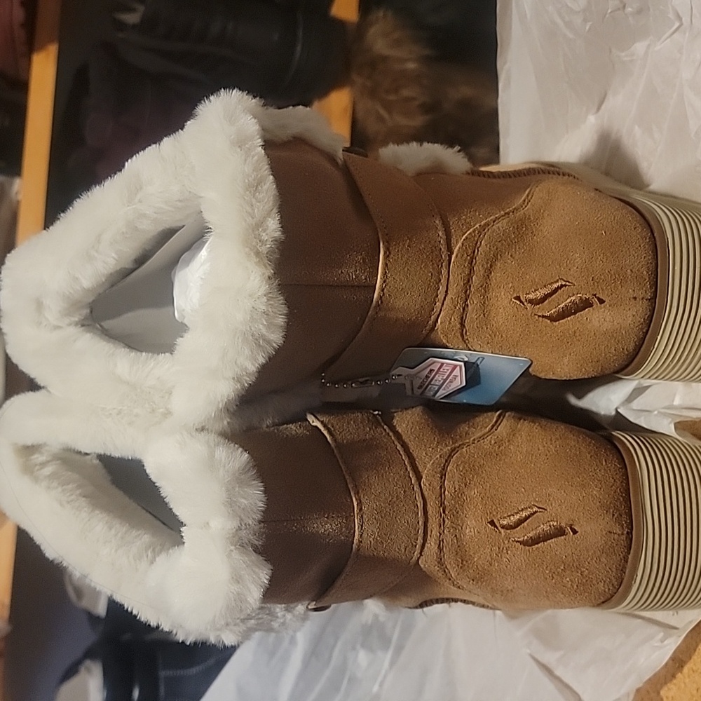 womens size 9. Gold colored, mid-calf boots